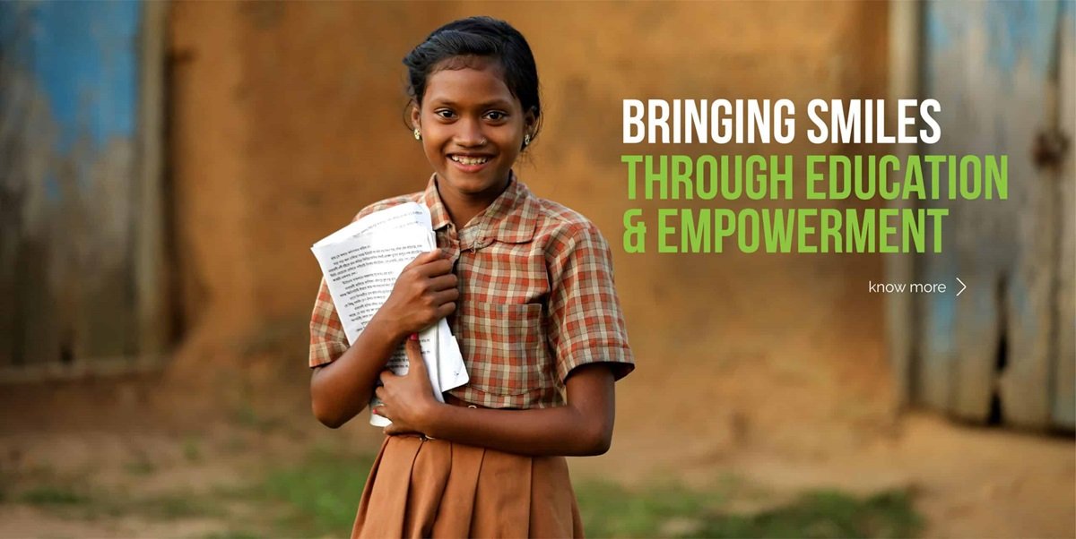 Children studying under a tree with books and Indian flag